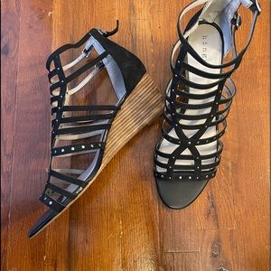Leather Caged Sandals with a wedge heel.
